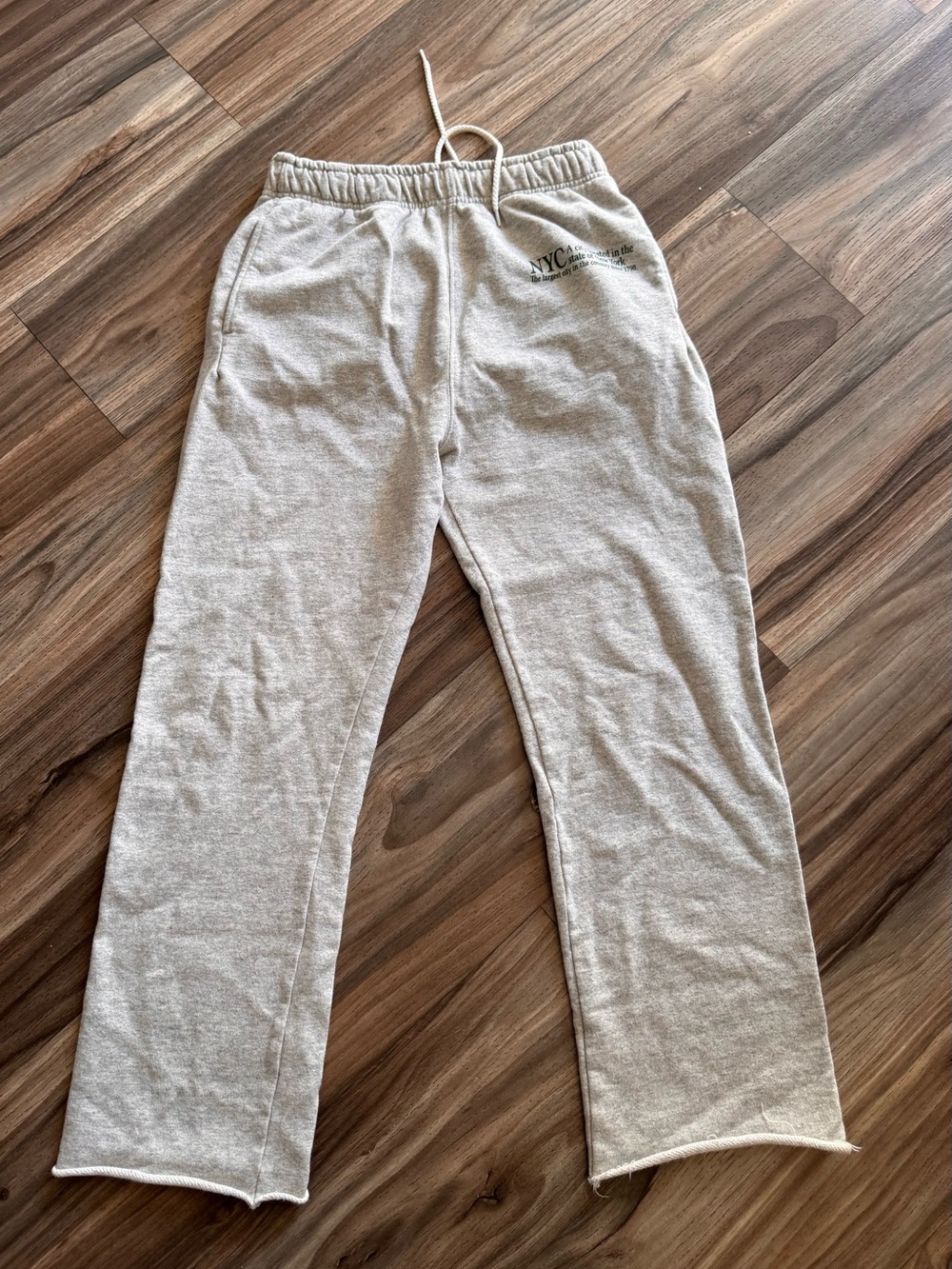 Cream Sweatpants with NYC Graphic.